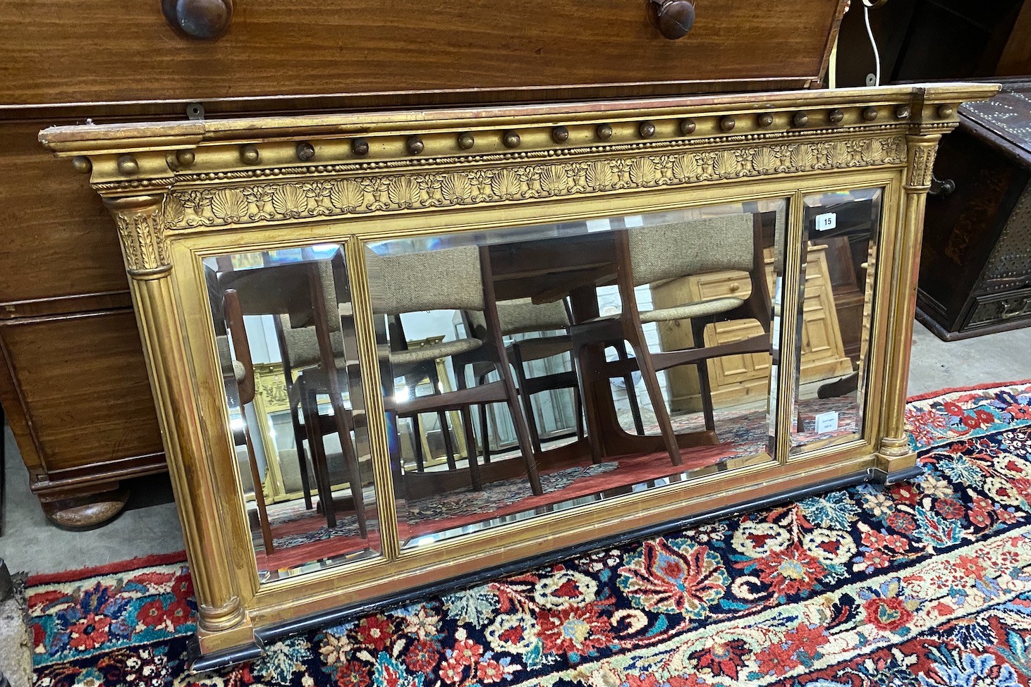 A large Regency giltwood and composition triple plate overmantel mirror, width 130cm, height 66cm